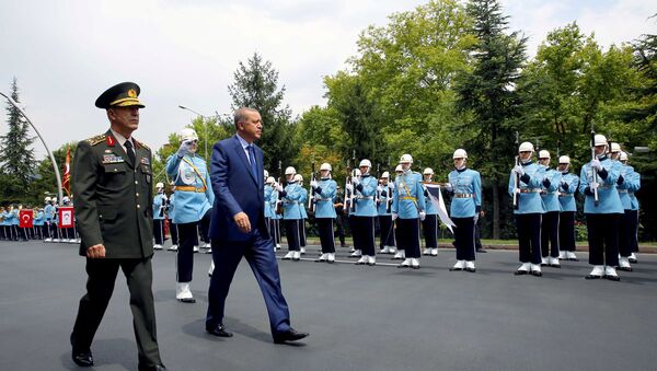 Turkey's President Tayyip Erdogan reviews a guard of honour as he is accompanied by Chief of Staff General Hulusi Akar upon his arrival to the Chief of Staff Headquarters in Ankara, Turkey, August 3, 2016. - Sputnik International