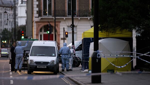 Police forensic officers work in Russell Square in London early on August 4, 2016, after a woman in her 60s was killed during a knife attack - Sputnik International