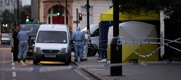 Police forensic officers work in Russell Square in London early on August 4, 2016, after a woman in her 60s was killed during a knife attack - Sputnik International
