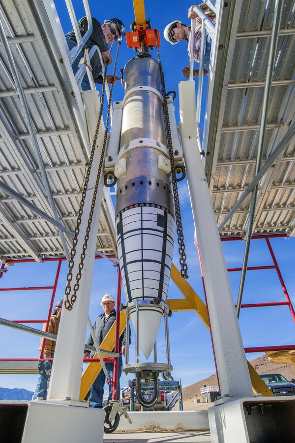 The nose assembly of a mock B61-12, mounted on an aluminum tube to replicate the body of the bomb, sits in a stand awaiting movement to Sandia National Laboratories’ Davis gun, which fired the test assembly into a pool in one of a series of impact tests The nose assembly of a mock B61-12, mounted on an aluminum tube to replicate the body of the bomb, sits in a stand awaiting movement to Sandia National Laboratories’ Davis gun, which fired the test assembly into a pool in one of a series of impact tests - Sputnik International