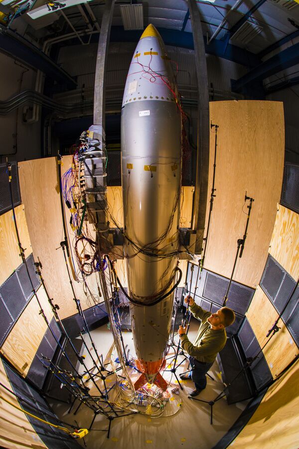 Sandia Labs mechanical engineer Ryan Schultz adjusts a microphone for an acoustic test on a B61-12 system Sandia Labs mechanical engineer Ryan Schultz adjusts a microphone for an acoustic test on a B61-12 system - Sputnik International