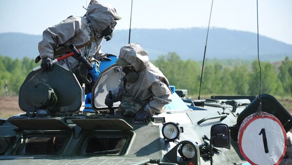 A nuclear, biological and chemical (NBC) reconnaissance crew during the regional stage of the Russian Army's Safe Environment 2016 NBC units contest in the Transbaikal region - Sputnik International