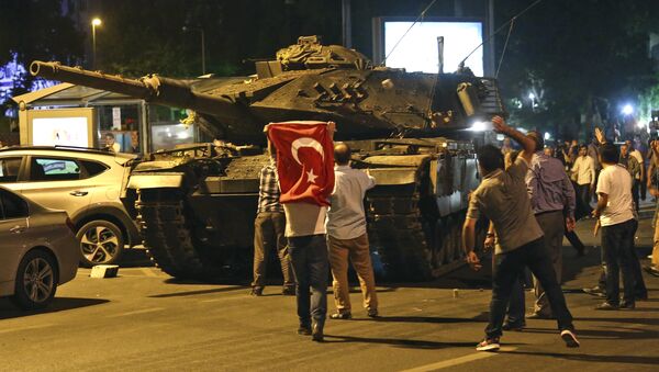 A tank moves into position as Turkish people attempt to stop them, in Ankara, Turkey, early Saturday, July 16, 2016 - Sputnik International