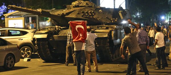 A tank moves into position as Turkish people attempt to stop them, in Ankara, Turkey, early Saturday, July 16, 2016 - Sputnik International