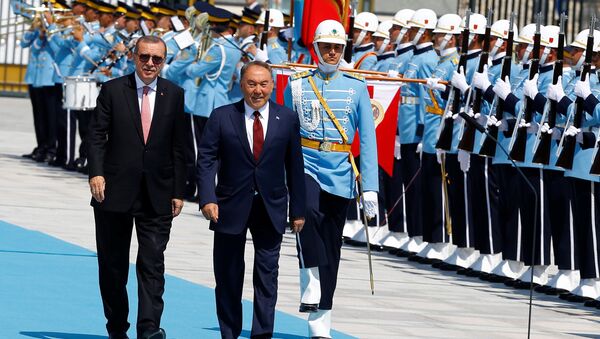 Turkish President Tayyip Erdogan and his Kazakh counterpart Nursultan Nazarbayev (R) review a guard of honour during a welcoming ceremony at the Presidential Palace in Ankara, Turkey, August 5, 2016 - Sputnik International