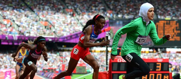 This file photo taken on August 8, 2012 shows (from L) Central Africa Republic's Elisabeth Mandaba, Colombia's Rosibel García and Saudi Arabia's Sarah al-Attar competing in the women's 800m heats at the athletics event of the London 2012 Olympic Games in the capital - Sputnik International