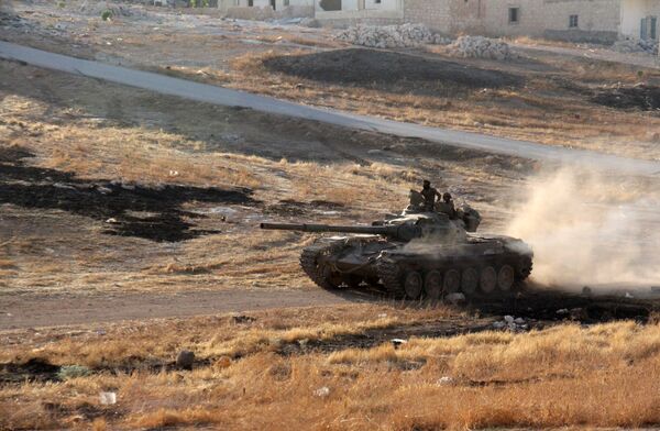 Opposition fighters drive a tank in the Al-Huweiz area on southern outskirts of Aleppo as they battle to break the government seige on the northen Syrian city on August 2, 2016 Opposition fighters drive a tank in the Al-Huweiz area on southern outskirts of Aleppo as they battle to break the government seige on the northen Syrian city on August 2, 2016 - Sputnik International