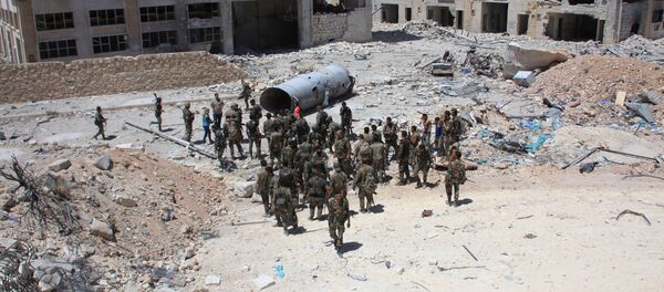 Syrian army soldiers patrol the area around the entrance of Bani Zeid after taking control of the previously rebel-held district of Leramun, on the northwest outskirts of Aleppo, on July 28, 2016 Syrian army soldiers patrol the area around the entrance of Bani Zeid after taking control of the previously rebel-held district of Leramun, on the northwest outskirts of Aleppo, on July 28, 2016 - Sputnik International