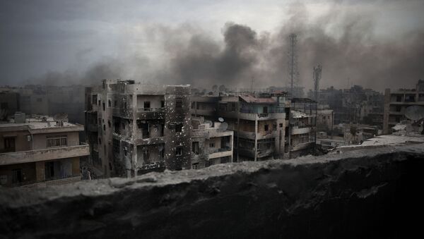 In this Tuesday, Oct. 2, 2012 file photo, smoke rises over Saif Al Dawla district, in Aleppo, Syria - Sputnik International