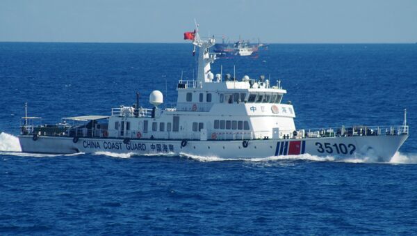 In this photo released by the 11th Regional Coast Guard Headquarters of Japan, a Chinese coast guard vessel sails near disputed East China Sea islands Saturday, Aug. 6, 2016 - Sputnik International