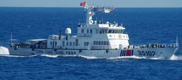 In this photo released by the 11th Regional Coast Guard Headquarters of Japan, a Chinese coast guard vessel sails near disputed East China Sea islands Saturday, Aug. 6, 2016 - Sputnik International