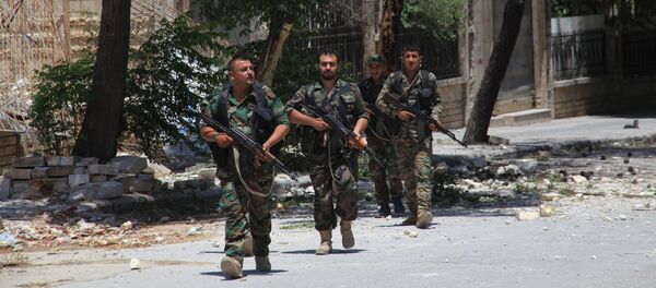 Syrian army soldiers patrol a street in government-controlled Aleppo's al-Khalidiya area (File) Syrian army soldiers patrol a street in government-controlled Aleppo's al-Khalidiya area (File) - Sputnik International