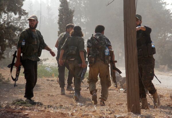 Fighters from the former Al-Nusra Front -- renamed Fateh al-Sham Front after breaking from Al-Qaeda -- advance at an armament school after they announced they seiged control of two military academies and a third military position on August 6, 2016, the Syrian Observatory for Human Rights said Fighters from the former Al-Nusra Front -- renamed Fateh al-Sham Front after breaking from Al-Qaeda -- advance at an armament school after they announced they seiged control of two military academies and a third military position on August 6, 2016, the Syrian Observatory for Human Rights said - Sputnik International