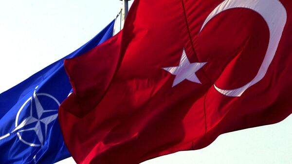 A Turkish flag waves in front of NATO's one - Sputnik International