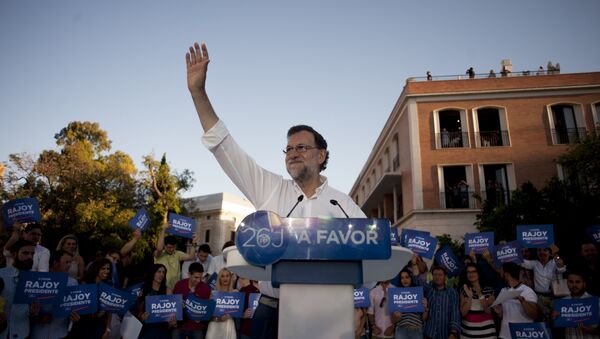 Leader of the People's Party (PP) and Spain's caretaker Prime Minister and party candidate, Mariano Rajoy, waves to supporters during a campaign meeting in Malaga. (File) - Sputnik International