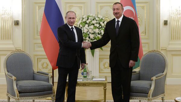 Russian President Vladimir Putin, left, and President of Azerbaijan Ilham Aliyev during a meeting at Genclik residence in Baku - Sputnik International