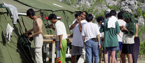 FILE - In this Sept. 21, 2001, file photo, men shave, brush their teeth and prepare for the day at a refugee camp on the Island of Nauru. FILE - In this Sept. 21, 2001, file photo, men shave, brush their teeth and prepare for the day at a refugee camp on the Island of Nauru. - Sputnik International