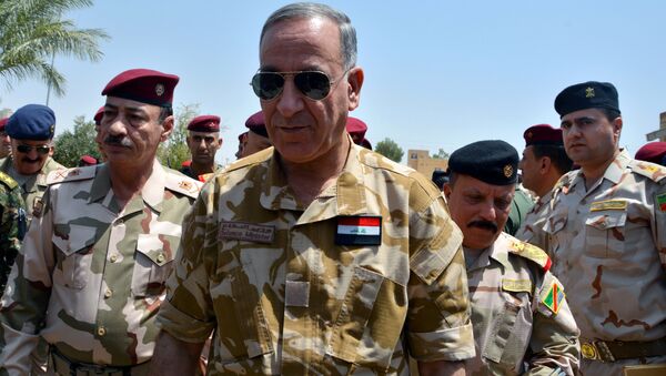 Iraqi Defence Minister Khaled al-Obeidi (C) walks during his visit to the Nineveh Liberation Operations Command at Makhmour base, south of Mosul, Iraq, August 8, 2016. - Sputnik International