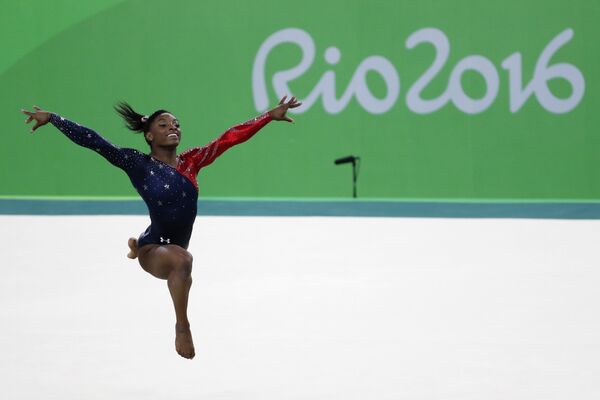 US gymnast Simone Biles competes in the qualifying for the women's Floor event of the Artistic Gymnastics at the Olympic Arena during the Rio 2016 Olympic Games in Rio de Janeiro on August 7, 2016. US gymnast Simone Biles competes in the qualifying for the women's Floor event of the Artistic Gymnastics at the Olympic Arena during the Rio 2016 Olympic Games in Rio de Janeiro on August 7, 2016. - Sputnik International