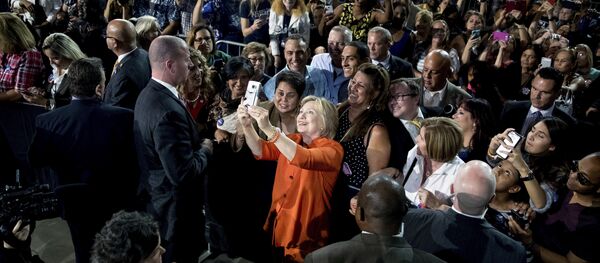 Democratic presidential candidate Hillary Clinton takes a photo with a member of the audience after speaking at a rally at Osceola Heritage Park, in Kissimmee, Fla., Monday, Aug. 8, 2016. Democratic presidential candidate Hillary Clinton takes a photo with a member of the audience after speaking at a rally at Osceola Heritage Park, in Kissimmee, Fla., Monday, Aug. 8, 2016. - Sputnik International