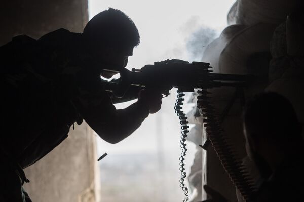 A soldier of the Syrian Arab Army is seen here in a residential area of Aleppo, a city divided by a front line A soldier of the Syrian Arab Army is seen here in a residential area of Aleppo, a city divided by a front line - Sputnik International