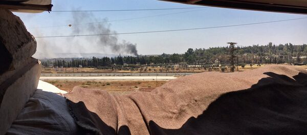 Smoke over Ramuse district of southern Aleppo Smoke over Ramuse district of southern Aleppo - Sputnik International