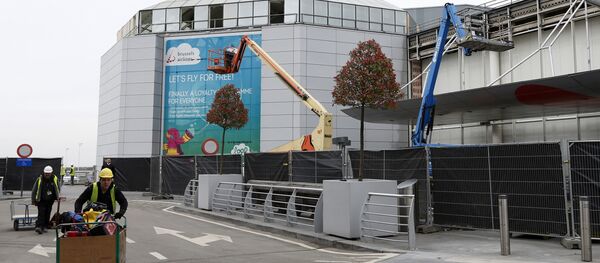Construction workers wheel equipment as they work at the departures hall at Zaventem Airport in Brussels on Friday. Construction workers wheel equipment as they work at the departures hall at Zaventem Airport in Brussels on Friday. - Sputnik International