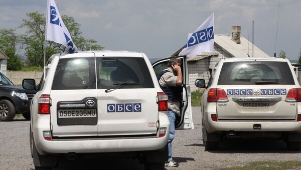 Vehicles of the OSCE Special Monitoring Mission in Dokuchayevsk, Donetsk Region - Sputnik International