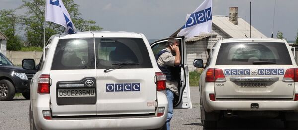 Vehicles of the OSCE Special Monitoring Mission in Dokuchayevsk, Donetsk Region - Sputnik International