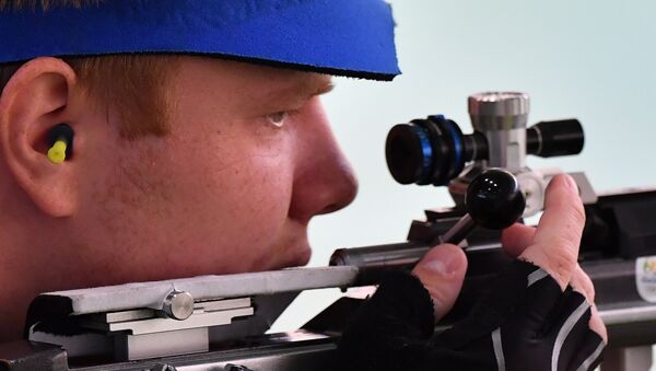 Kirill Grigoryan (Russia) during the men’s 50m rifle prone event at the XXXI Summer Olympics - Sputnik International