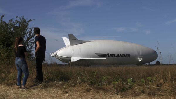 The Airlander 10 hybrid airship is seen after it recently left the hangar for the first time to commence ground systems tests before its maiden flight, at Cardington Airfield in Britain August 9, 2016 - Sputnik International