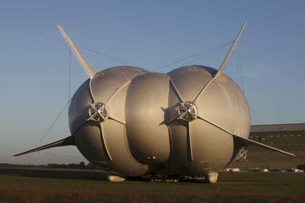 The Airlander 10 hybrid airship is seen after it recently left the hangar for the first time to commence ground systems tests before its maiden flight, at Cardington Airfield in Britain August 9, 2016 The Airlander 10 hybrid airship is seen after it recently left the hangar for the first time to commence ground systems tests before its maiden flight, at Cardington Airfield in Britain August 9, 2016 - Sputnik International