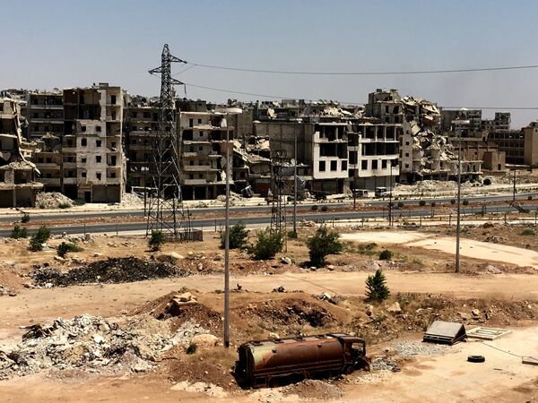 Damaged buildings in Al-Ramouseh district in southern Aleppo Damaged buildings in Al-Ramouseh district in southern Aleppo - Sputnik International