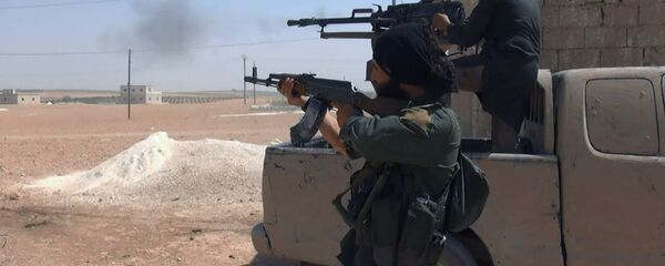 Islamic State fighters fire their weapons during clashes with the Kurdish-led Syria Democratic Forces in Manbij, in Aleppo province, Syria (File) Islamic State fighters fire their weapons during clashes with the Kurdish-led Syria Democratic Forces in Manbij, in Aleppo province, Syria (File) - Sputnik International