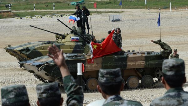 China's BMP-2 crew which took a second place the final contest of the Suvorovsky Natisk (Suvorov Onslaught) competition at the Alabino training ground in the Moscow Region. Background: Russia's BMP-2 crew which won the final contest of the Suvorovsky Natisk (Suvorov Onslaught) competition at the Alabino training ground in the Moscow Region - Sputnik International