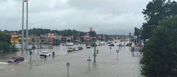 Floodwaters are seen on Range Road and I-12 in Denham Springs, Livingston Parish, Louisiana, U.S., August 13, 2016 Floodwaters are seen on Range Road and I-12 in Denham Springs, Livingston Parish, Louisiana, U.S., August 13, 2016 - Sputnik International
