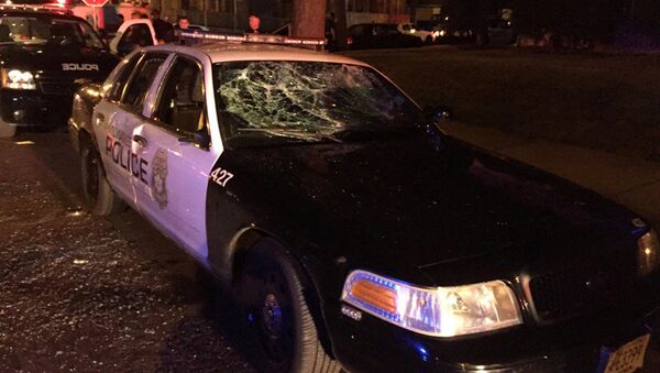 A police car with broken windows is seen in a photograph released by the Milwaukee Police Department after disturbances following the police shooting of a man in Milwaukee, Wisconsin, U.S. August 13, 2016 - Sputnik International