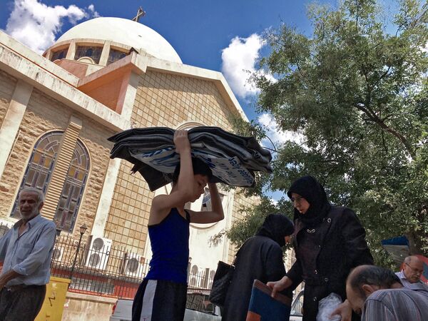 Refugees from block 1070 in south-western Aleppo who received aid in a Sunday Orthodox School by an Orthodox church in Aleppo Refugees from block 1070 in south-western Aleppo who received aid in a Sunday Orthodox School by an Orthodox church in Aleppo - Sputnik International