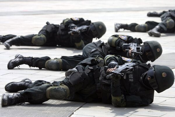 Special police forces demonstrate their craft during a drill to mark the launch of a training program on Beijing Olympic Games security held at the Beijing People's Police Institute on the outskirts of Beijing, China. file photo Special police forces demonstrate their craft during a drill to mark the launch of a training program on Beijing Olympic Games security held at the Beijing People's Police Institute on the outskirts of Beijing, China. file photo - Sputnik International