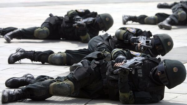 Special police forces demonstrate their craft during a drill to mark the launch of a training program on Beijing Olympic Games security held at the Beijing People's Police Institute on the outskirts of Beijing, China. file photo - Sputnik International