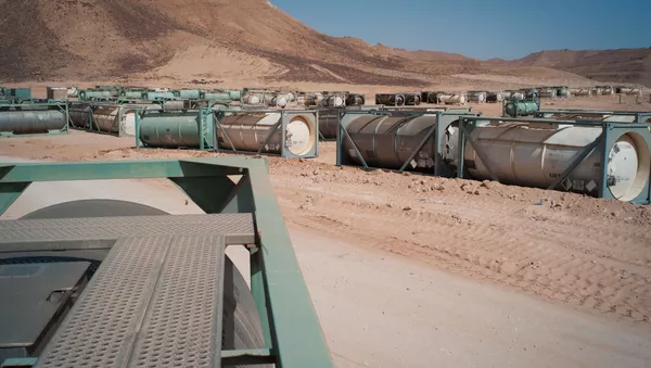 In this Wednesday, Oct. 26, 2011 photo, chemical containers are seen in an unguarded storage facility in the desert, some 62 miles (100 kilometers) south of Sirte, Libya. - Sputnik International