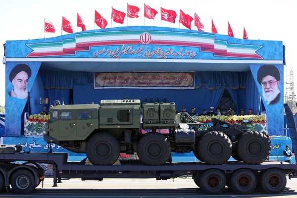 In front of the portraits of supreme leader Ayatollah Ali Khamenei, right, and late revolutionary founder Ayatollah Khomeini, left, a long-range, S-300 missile system is displayed by Iran's army during a parade marking National Army Day at the mausoleum of the late revolutionary founder Ayatollah Khomeini, outside Tehran. file photo In front of the portraits of supreme leader Ayatollah Ali Khamenei, right, and late revolutionary founder Ayatollah Khomeini, left, a long-range, S-300 missile system is displayed by Iran's army during a parade marking National Army Day at the mausoleum of the late revolutionary founder Ayatollah Khomeini, outside Tehran. file photo - Sputnik International