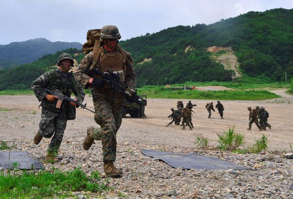 South Korea and US Marines run to a position during a joint military drill at a fire training field in the southeastern port of Pohang on July 6, 2016 South Korea and US Marines run to a position during a joint military drill at a fire training field in the southeastern port of Pohang on July 6, 2016 - Sputnik International