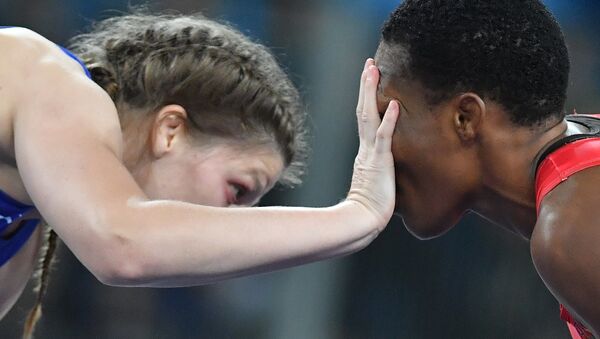 Female wrestler Ekaterina Bukina won bronze in women's freestyle 75 kg defeating Annabel Laure Ali from Cameroon. - Sputnik International