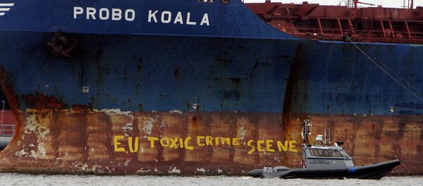A police ship patrols near the Panamanian-registered vessel Probo Koala, suspected of dumping toxic waste in waters off Ivory Coast - Sputnik International