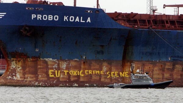 A police ship patrols near the Panamanian-registered vessel Probo Koala, suspected of dumping toxic waste in waters off Ivory Coast - Sputnik International