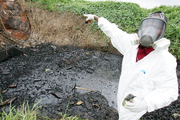 A civil protection member of Ivory Coast points at a site polluted with toxic waste at the Akouedo district in Abidjan 19 September 2006. In mid-August the Probo Koala ship unloaded in Abidjan more than 500 tonnes of a highly toxic mixture of oil residue and caustic soda used to rinse out the ship's tanks. The poisons are known to cause nausea, rashes, fainting, diarrhoea and headaches. Besides the seven deaths, 24 people are still hospitalized and more than 37,000 have sought medical treatment. A civil protection member of Ivory Coast points at a site polluted with toxic waste at the Akouedo district in Abidjan 19 September 2006. In mid-August the Probo Koala ship unloaded in Abidjan more than 500 tonnes of a highly toxic mixture of oil residue and caustic soda used to rinse out the ship's tanks. The poisons are known to cause nausea, rashes, fainting, diarrhoea and headaches. Besides the seven deaths, 24 people are still hospitalized and more than 37,000 have sought medical treatment. - Sputnik International