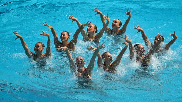 The Russian team performs the technical routine at the synchronized swimming group event at the XXXI Summer Olympics - Sputnik International
