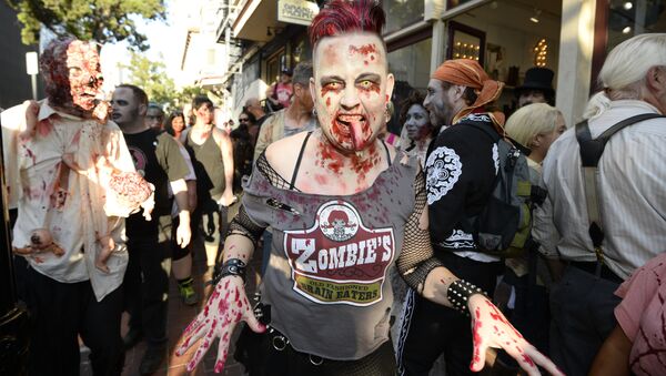 Zombies walk down Fifth Avenue as they take part in the Zombie Walk on day three of the Comic-Con International held at the San Diego Convention Center - Sputnik International