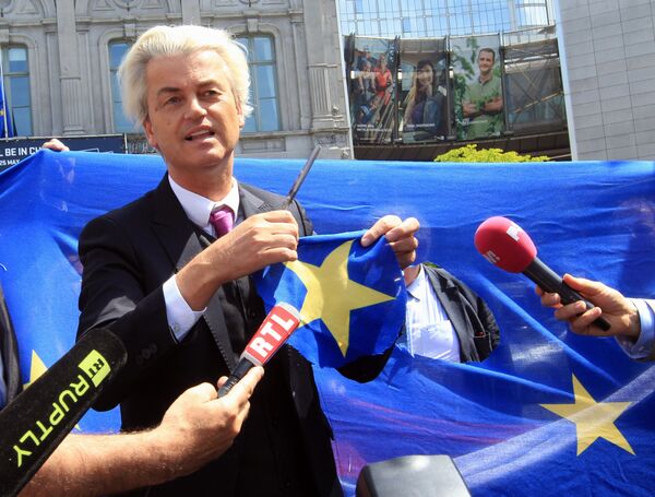 Dutch populist and euro-sceptic Geert Wilders displays a yellow star he cut out of the EU flag, during news conference, in front of the European Parliament in Brussels (File) Dutch populist and euro-sceptic Geert Wilders displays a yellow star he cut out of the EU flag, during news conference, in front of the European Parliament in Brussels (File) - Sputnik International